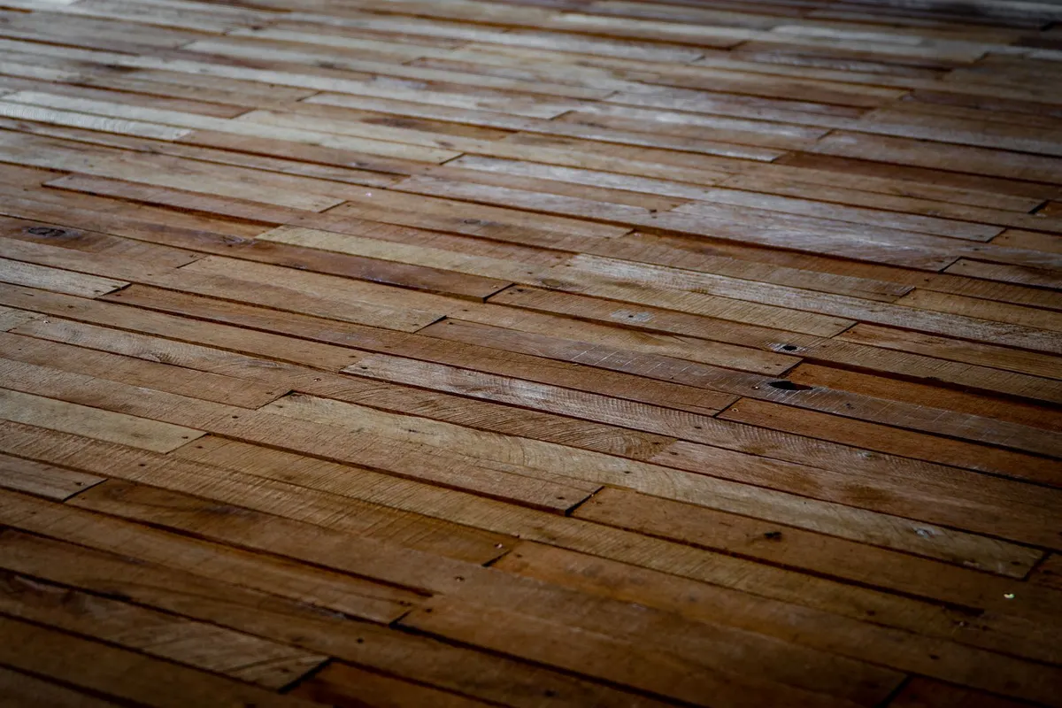 Wooden floorboards laid in a staggered pattern