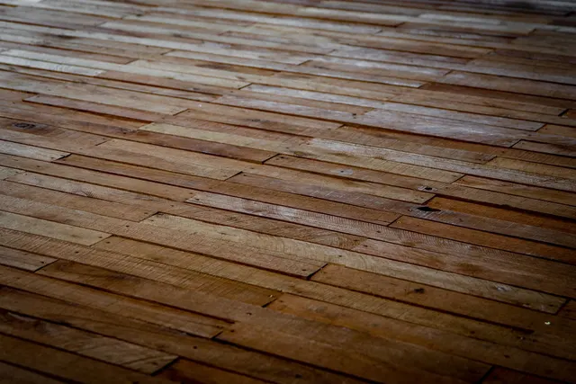 Wooden floorboards laid in a staggered pattern