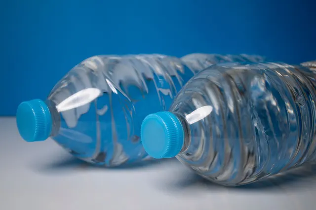 Bottled drinking water with sealed blue caps