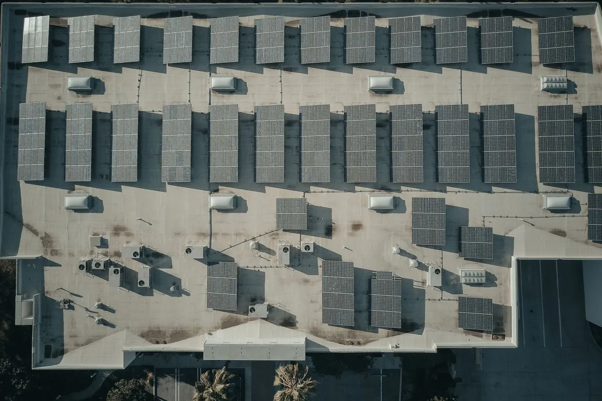 An array of solar panels on a building roof